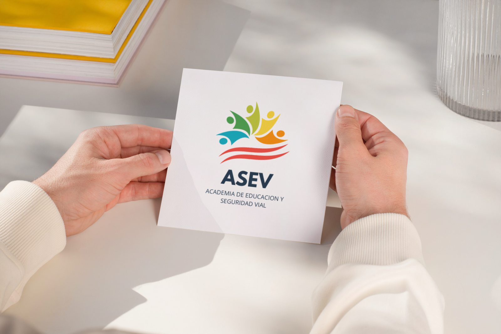 Square envelope in the hands of a man logo asev 1